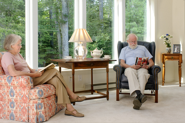 Two residents reading in cottage